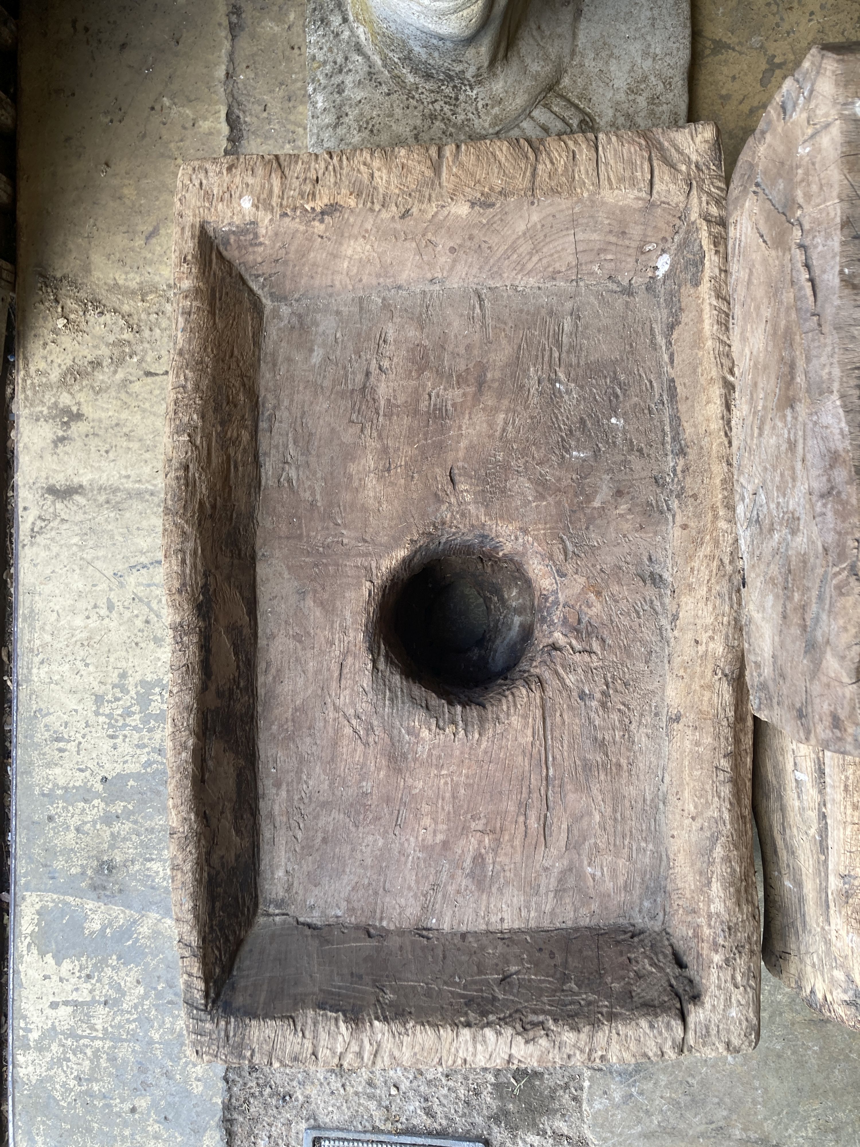 Three Indonesian hardwood rice mortars, largest 60cm, depth 38cm, height 23cm